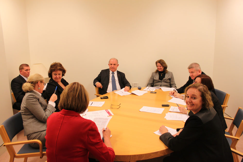 Selection of Bills Committee in private session, 17 June 2013. Clockwise around table from top: Senators Helen Kroger [Opposition Whip], Mitch Fifield, Rachel Siewert [Australian Greens Whip] (obscured), Carol Brown and Anne McEwen [Chair; Government Whip], Maureen Weeks [Secretary], Senators Jacinta Collins and John Williams [The Nationals Whip].