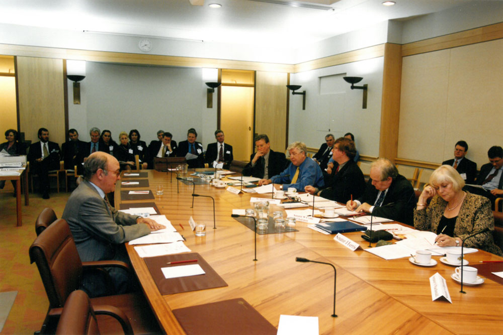 Rural and Regional Affairs and Transport Legislation Committee at estimates hearings in 2000. Seated at table R-L: Senators Jeannie Ferris and Winston Crane, Andrew Snedden [Secretary] and Senators Michael Forshaw and Kerry O'Brien.