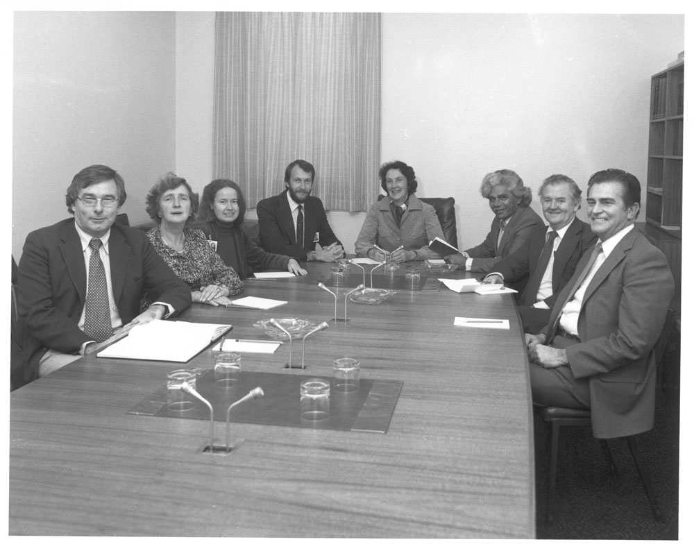 Standing Committee on Social Welfare, 20 October 1981. L-R: Senators Don Grimes and Joan Melzer, Patricia Mayberry [Research Officer], Peter Keele [Secretary], Senators Shirley Walters [Chair], Neville Bonner, Bernie Kilgariff and Ron Elstob. NAA: A6180,  20/10/81/1.