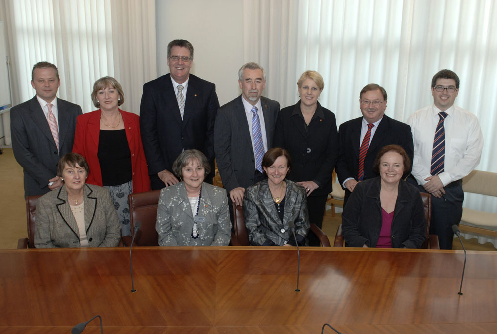 Members and staff of the Standing Committee on Community Affairs, 14 May 2009. Standing L-R: Ivan Powell [Research Officer], Senators Sue Boyce, Mark Furner, Gary Humphries and Catryna Bilyk, Elton Humphery [Secretary] and Owen Griffiths [Research Officer]. Seated L-R: Senators Judith Adams, Claire Moore [Chair], Rachel Siewert [Deputy Chair] and Carol Brown. DPS Auspic.