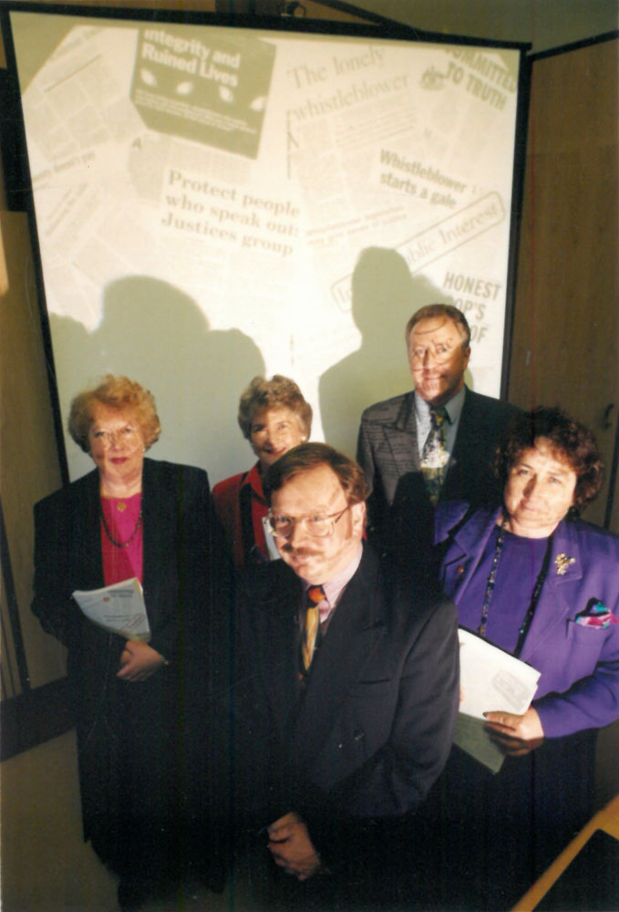 Committee members and secretary posing with the report, 31 August 1994. Back row L-R: Senators Kay Denman, Jocelyn Newman [Chair] and Shayne Murphy [Deputy Chair]. Front row L-R: Elton Humphery [Secretary] and Senator Christabel Chamarette. DPS Auspic.