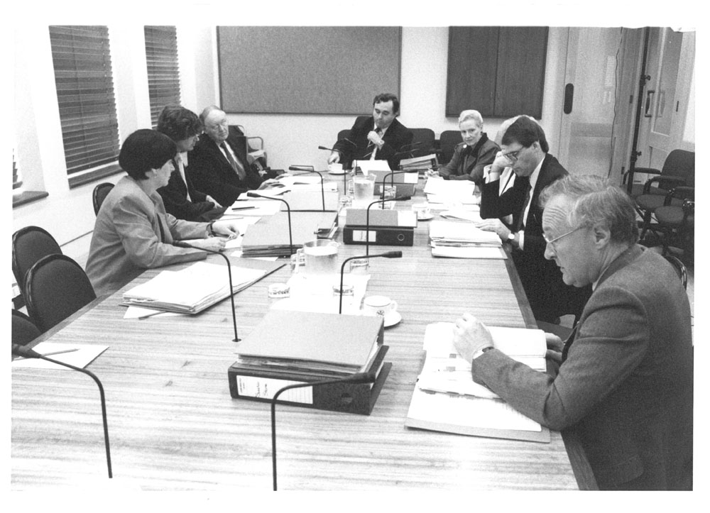 Standing Committee on Regulations and Ordinances in session, 1989. L-R: Senator Kay Patterson, David Creed [Secretary], Professor Douglas Whalan [Legal Adviser], Senators Bob Collins [Chair], Bronwyn Bishop, Patricia Giles (obscured), John Faulkner and John Stone. Government Photographic Service.
