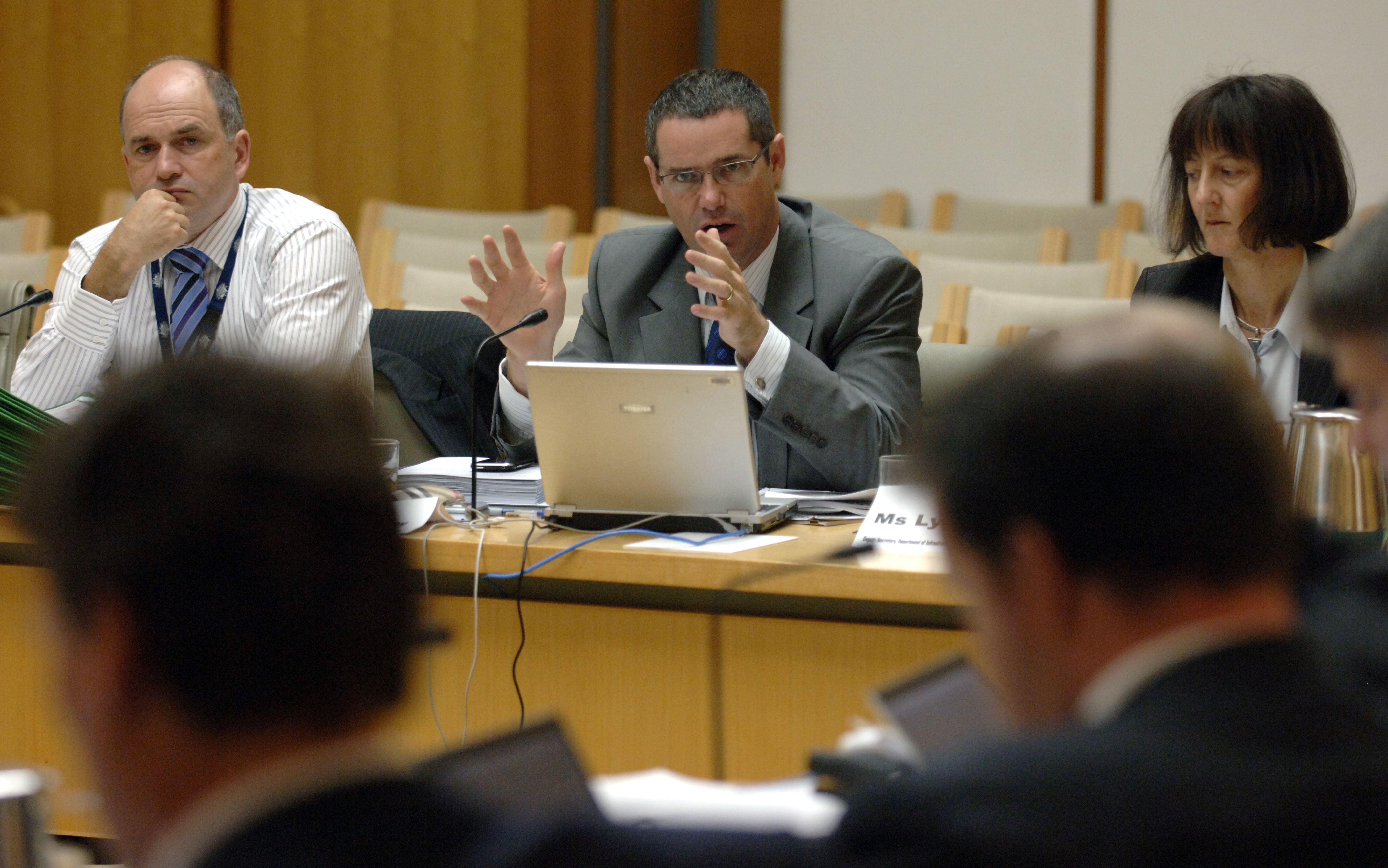 Senator Stephen Conroy, Minister for Broadband, Communications and the Digital Economy, answering questions during the hearing, 24 February 2009. The minister is flanked by Deputy Secretaries of the Department of Infrastructure, Transport, Regional Development and Local Government, Andrew Tongue and Lyn O'Connell. DPS Auspic.