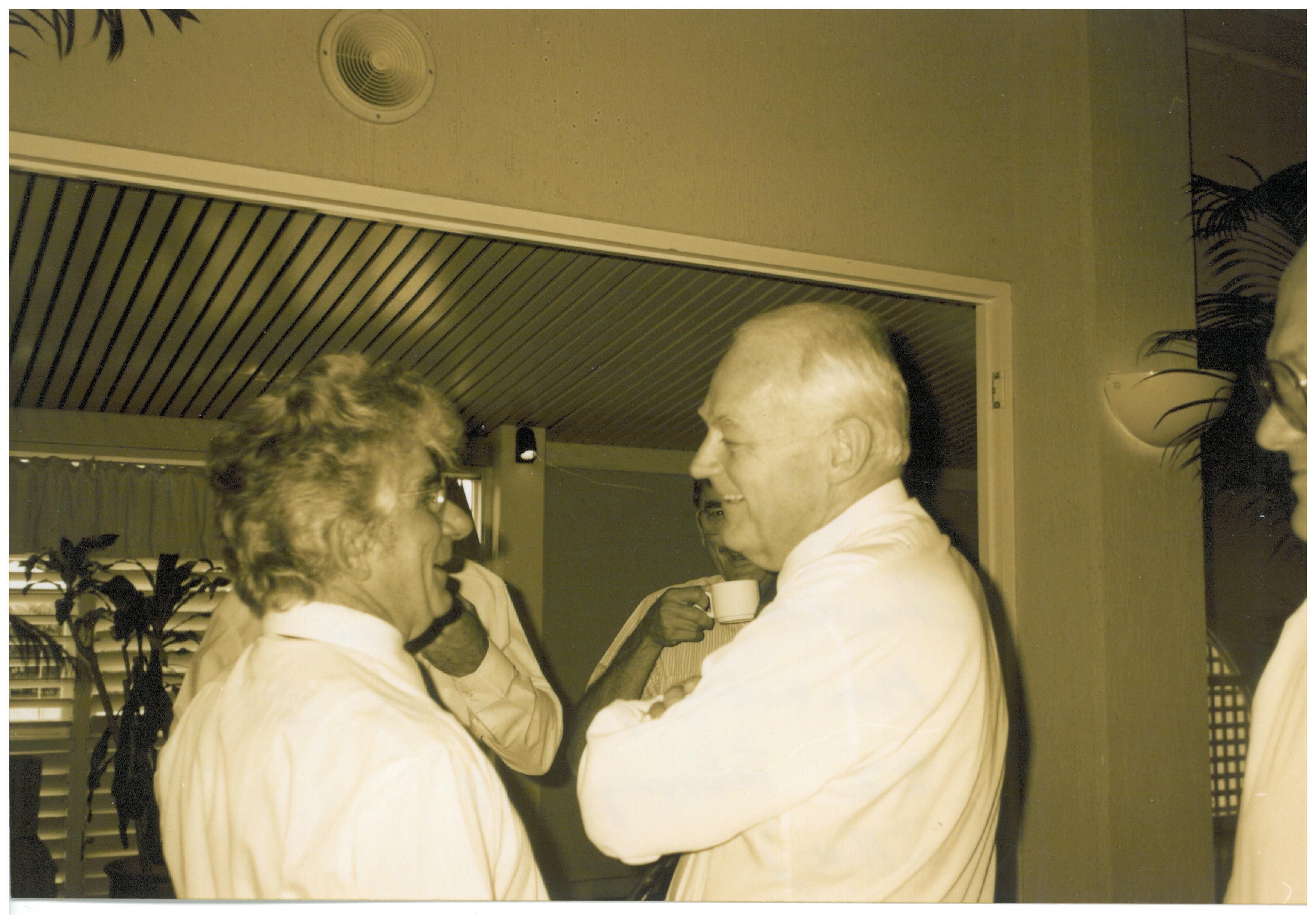 Committee chair Senator John Herron (right) speaking to witnesses Remzi Mulla [Chairman, Tobacco Leaf Marketing Board, Queensland] during a break in the Cairns hearing, 22 February 1995.