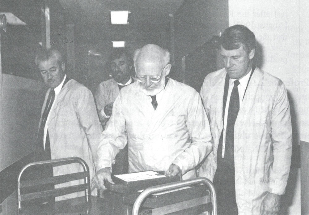 Select Committee on the Dangers of Radioactive Waste members examining technetium-99 generators used for medical purposes. L-R: Senators Alan Ferguson, John Coulter and Grant Chapman. Image by ANSTO.