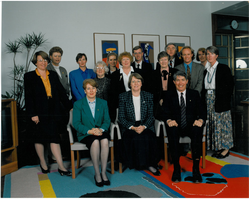 Members and staff of the Standing Committee on Community Affairs, 22 September 1994. Standing L-R: Senators Meg Lees and Sue Knowles, Robyn Hardy [Adviser/Consultant], Jean Willoughby [Executive Assistant], Mary Deane [Executive Assistant], Senator Kay Denman, Peter Short [A/g Principal Research Officer], Senators Olive Zakharov and Michael Forshaw, Alistair Sands [Principal Research Officer], Leonie Peake [Estimates/Research Officer] and Dr Pauline Moore [Secretary]. Seated L-R: Senators Judith Troeth, Sue West [Chair] and Sandy Macdonald. DPS Auspic.