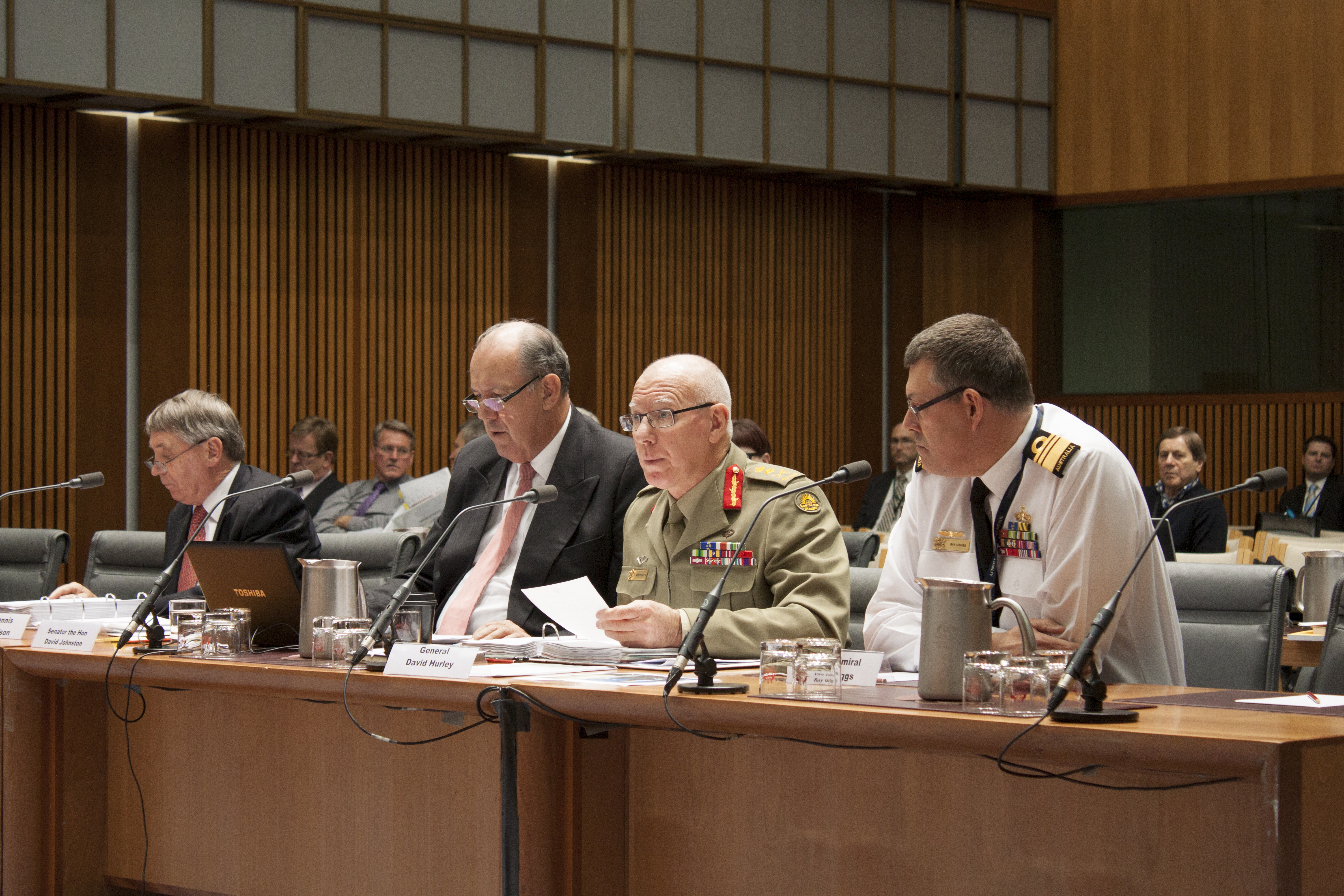 Witnesses at Foreign Affairs, Defence and Trade Legislation Committee budget estimates hearing, 2 June 2014. Seated at witness table L-R: Witnesses Dennis Richardson [Secretary, Department of Defence], Senator David Johnston [Minister for Defence], General David Hurley [Chief of the Defence Force] and Vice Admiral Ray Griggs [Chief of Navy].