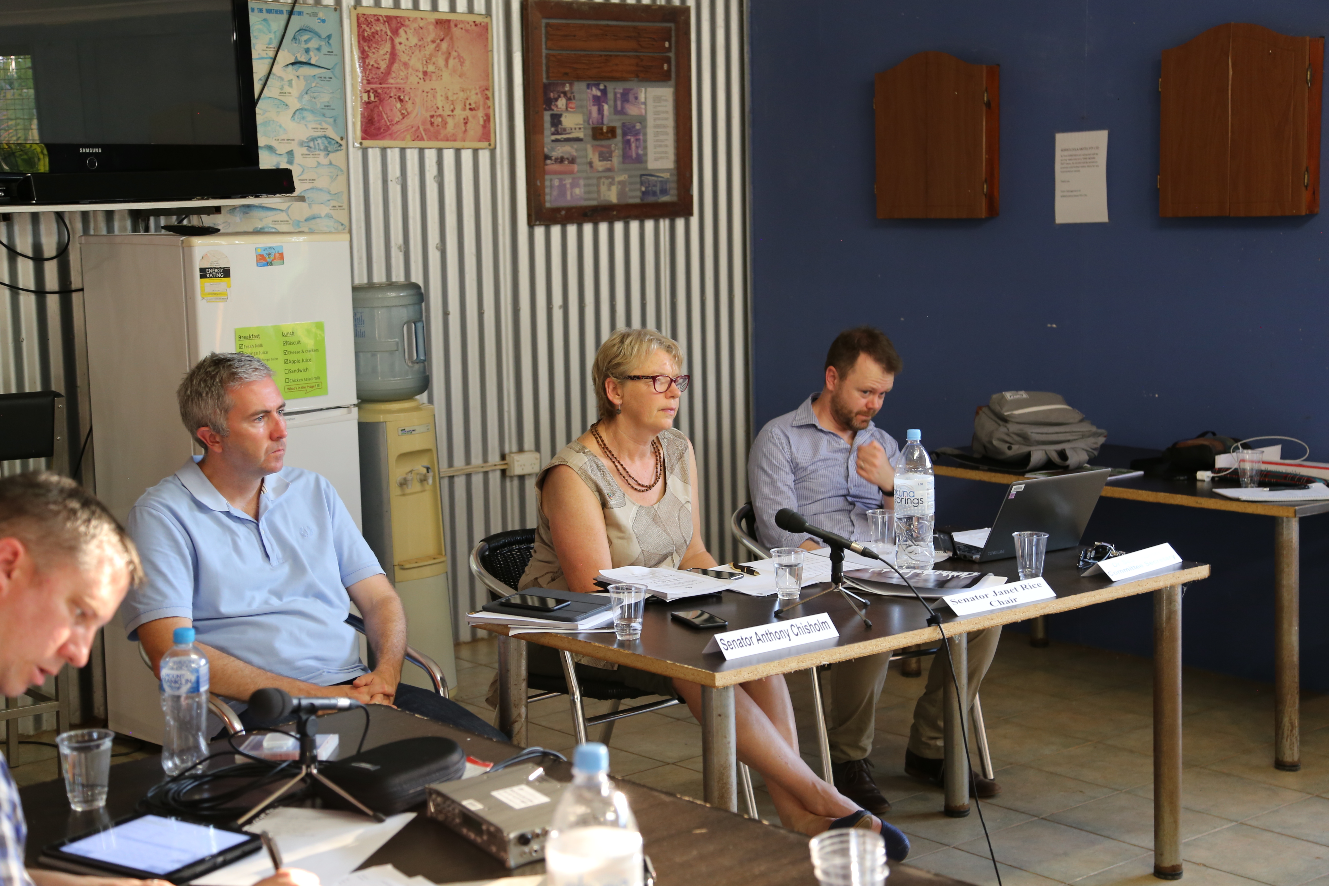 Senators Anthony Chisholm and Janet Rice and committee secretary Dr Sean Turner at the Environment and Communications References Committee hearing at Borroloola, NT, 31 October 2017. When broadcasting equipment stopped working the hearing had to be recorded using smartphones placed strategically around the room.