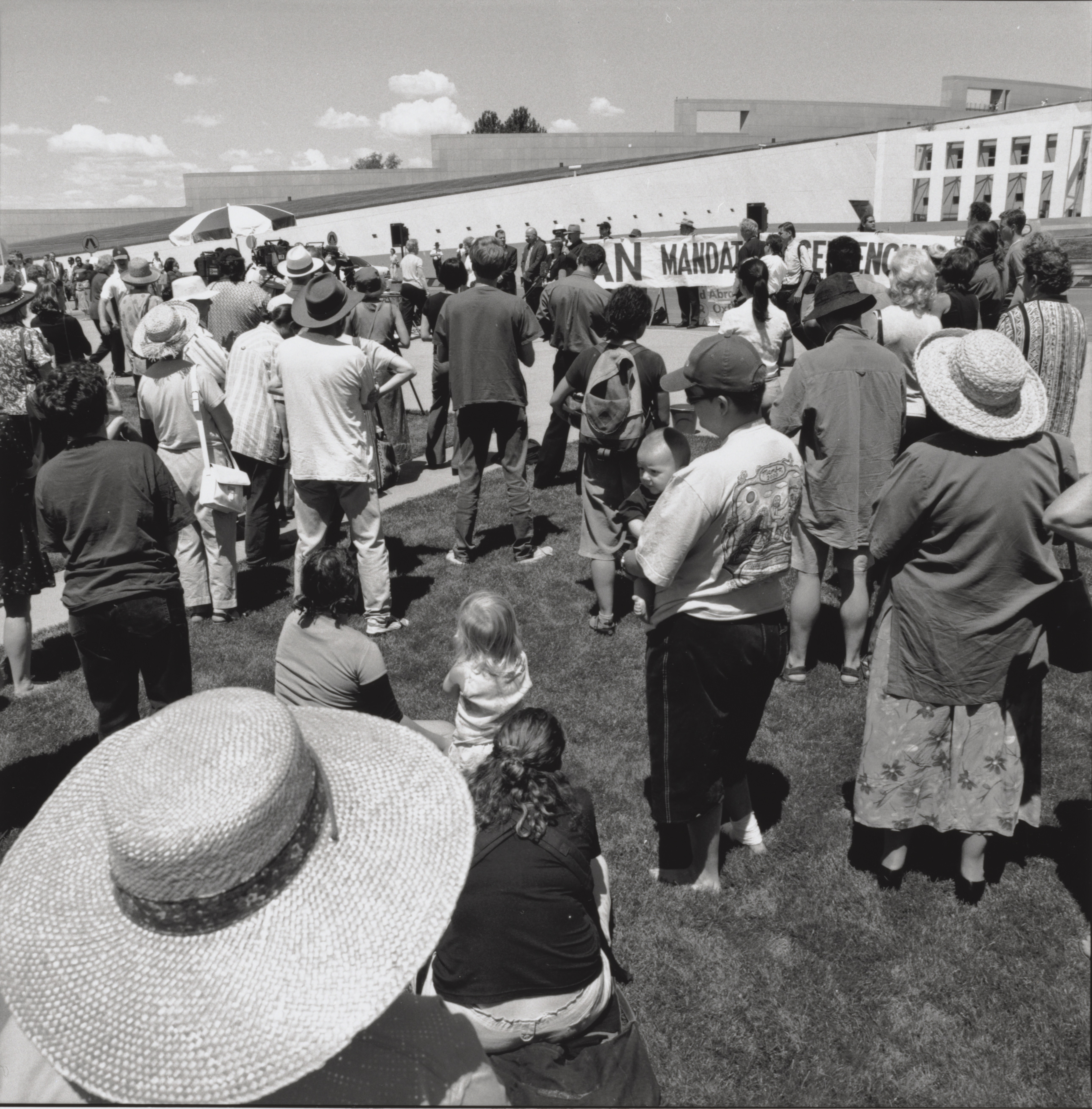 Loui Seselja, Photograph of a protest rally against Northern Territory and Western Australian mandatory sentencing laws held on the final day of the Senate Legal and Constitutional References Committee inquiry into mandatory sentencing, 17 February 2000, at Parliament House, Canberra. National Library of Australia, PIC NL38400/23A/7.