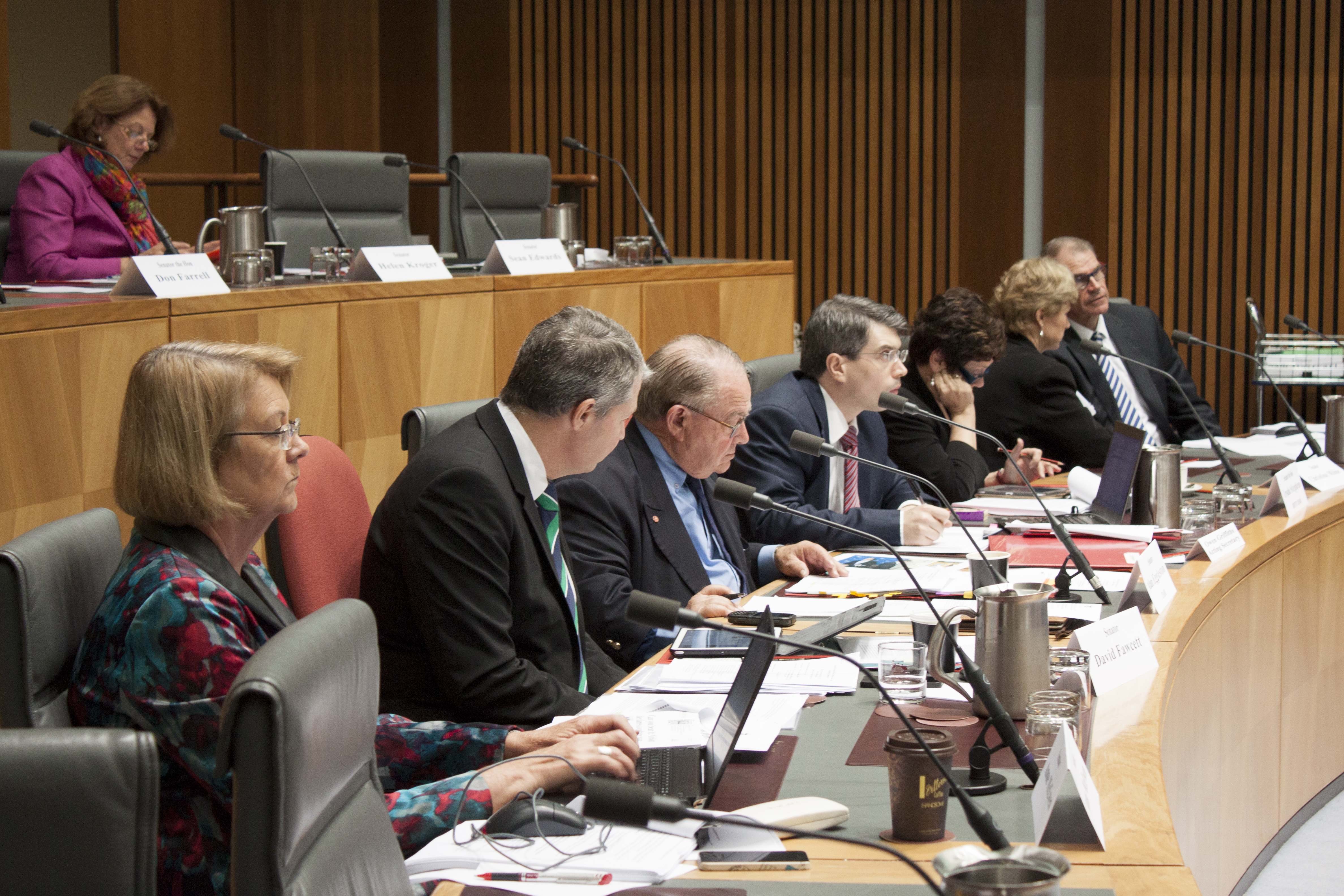 Foreign Affairs, Defence and Trade Legislation Committee budget estimates hearing, 2 June 2014. Senator Helen Kroger seated in top row. Bottom row L-R: Senators Anne McEwen, David Fawcett and Alan Eggleston [Chair], Owen Griffiths [Acting Secretary], Senators Ursula Stephens [Deputy Chair], Christine Milne and John Faulkner.