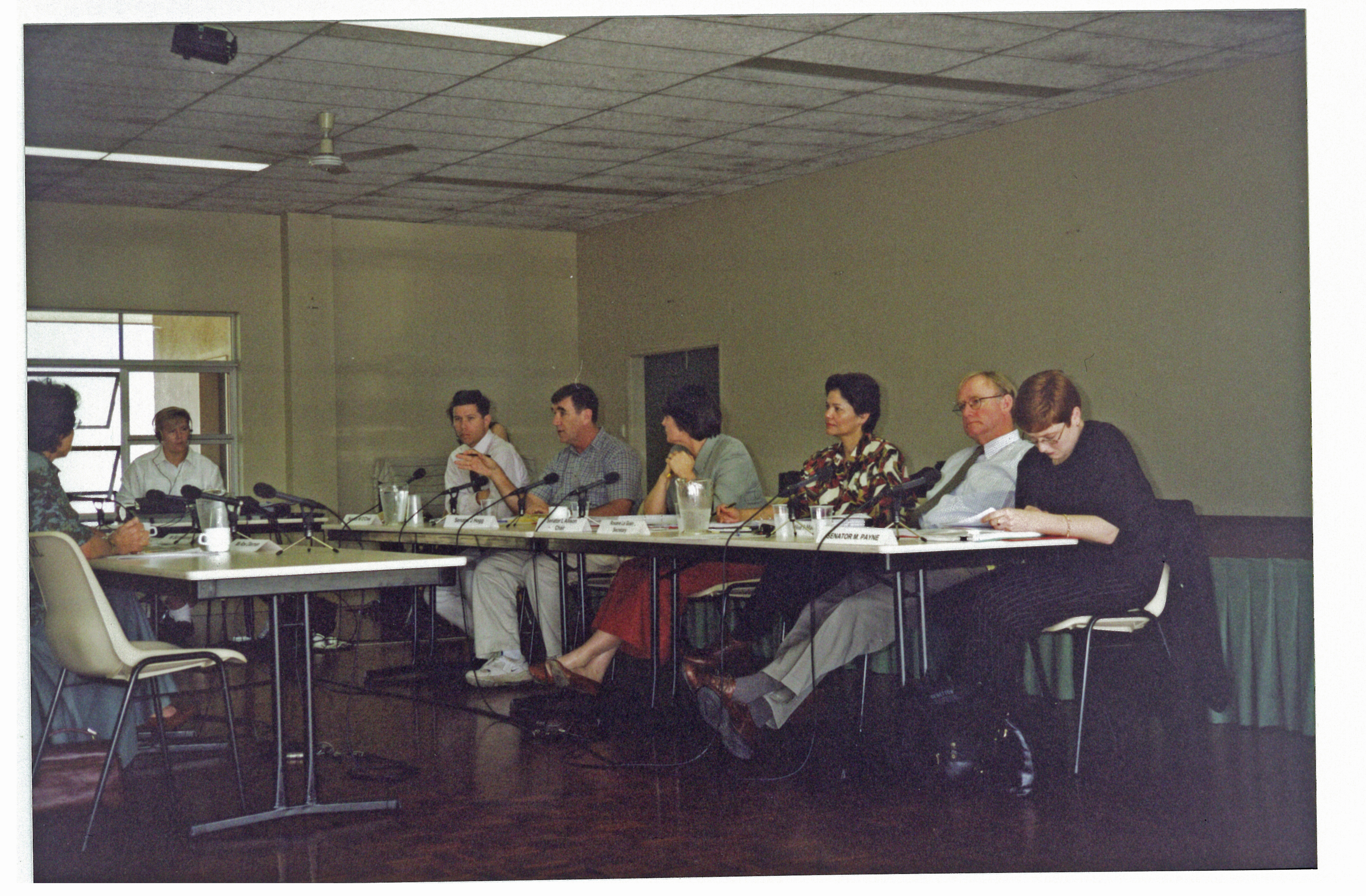 Cardwell hearings of the committee, July 1998. L-R: Witness, broadcasting officer and Senators Bill O'Chee, John Hogg and Lyn Allison [Chair], Roxane Le Guin [Committee Secretary] and Senators Ian MacDonald and Marise Payne.