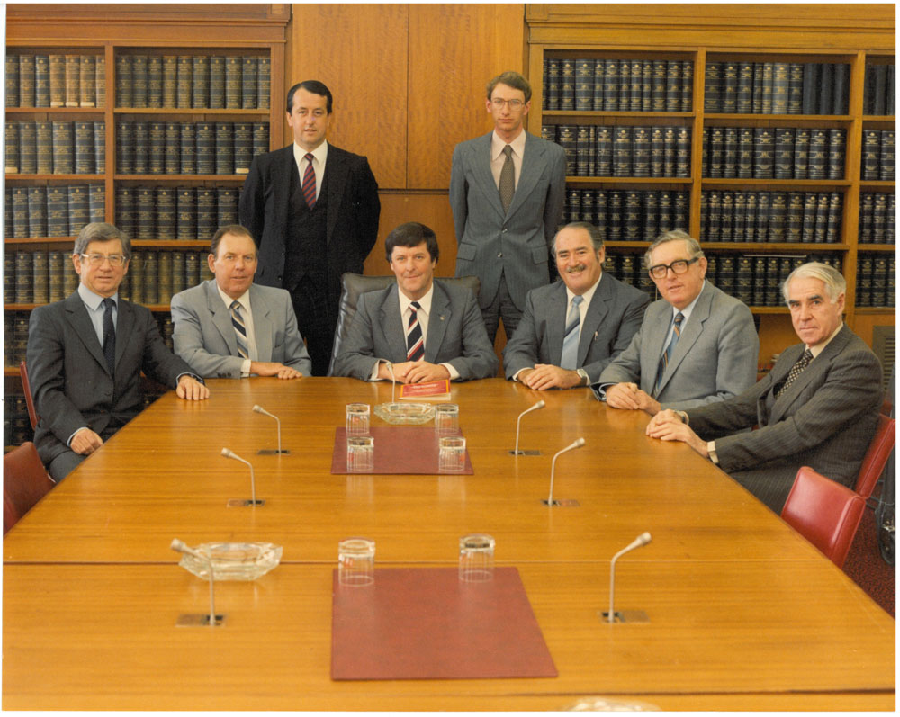 Select Committee on Parliament's Appropriations and Staffing, ca1980-81. Standing L-R: Peter Murdoch [Secretary; Usher of the Black Rod] and Cleaver Elliott [Research Officer]. Seated L-R: Senators Colin Mason, Douglas McClelland [Deputy Chair], Donald Jessop [Chair], Ted Robertson, Alan Missen and Peter Sim.