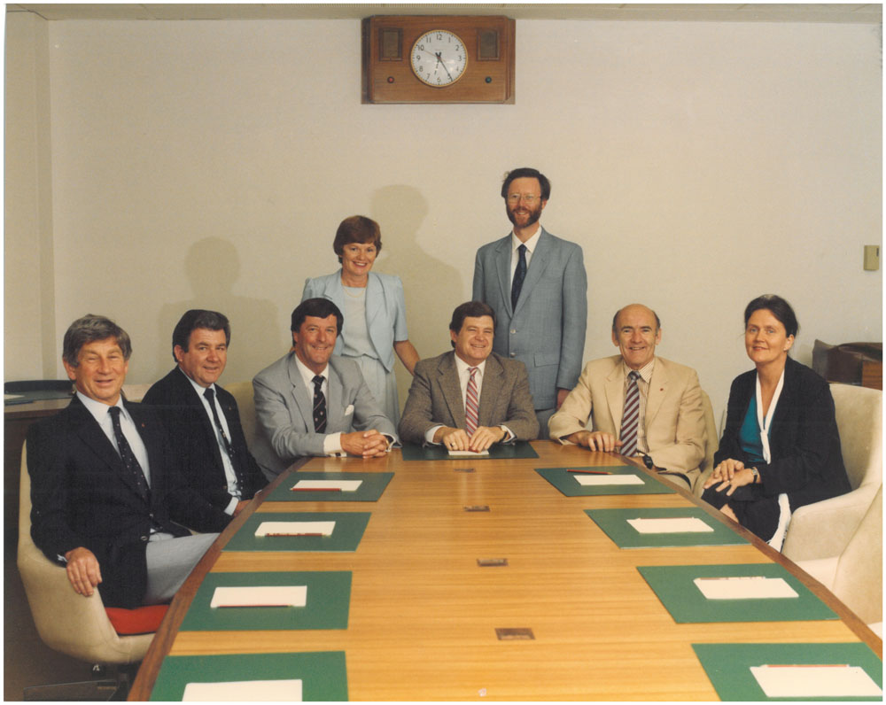 Standing Committee on Science and the Environment, ca1983-84. Standing L-R: Lyn Willson [Research Officer] and Robert King [Secretary]. Seated L-R: Senators Colin Mason, Dominic Foreman, Don Jessop [Deputy Chair], Gerry Jones [Chair], Michael Townley and Margaret Reynolds.