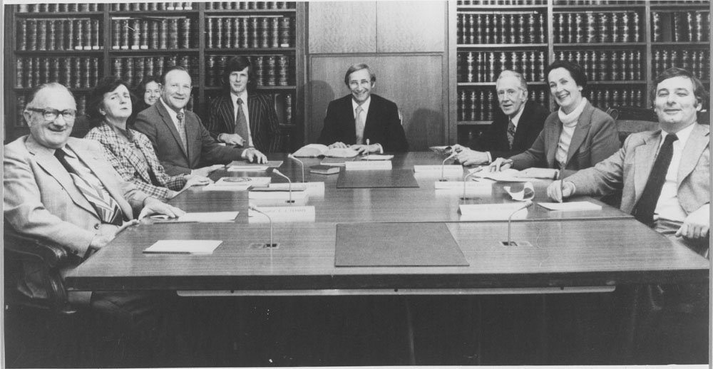 Standing Committee on Social Welfare, September 1976. L-R: Senators Tom Tehan and Jean Melzer, Patricia Mayberry [Research Officer], R.P. Joske [Secretary], Ken Bone [Research Officer], Senators Peter Baume [Chair], Bill Brown, Shirley Walters and Don Grimes.
