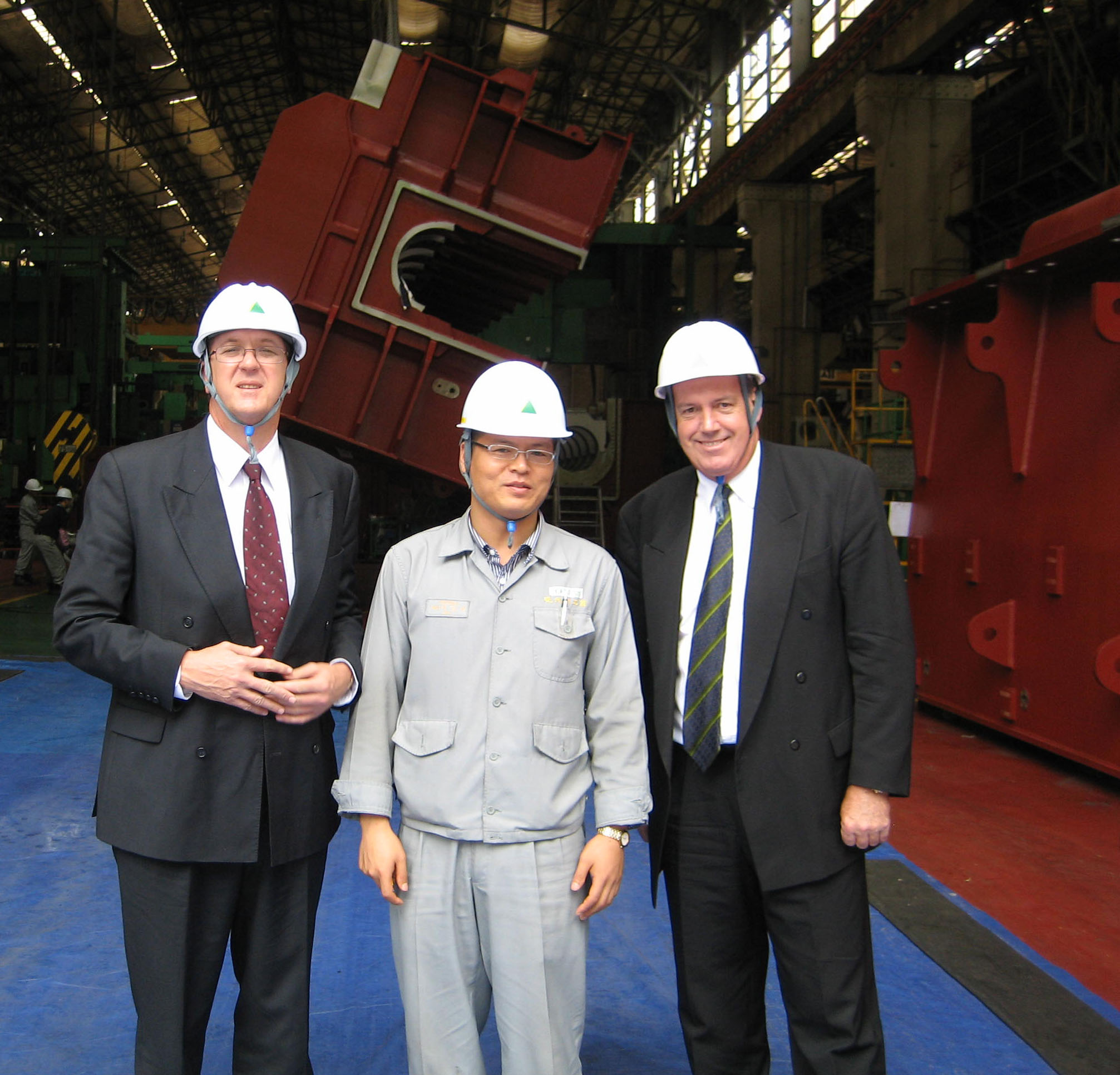 Foreign Affairs Defence and Trade Committee members Senators Mark Bishop (L) and David Johnston (R) on delegation at Hyundai Heavy Industries' shipyard at Ulsan, South Korea, 15 September 2006.