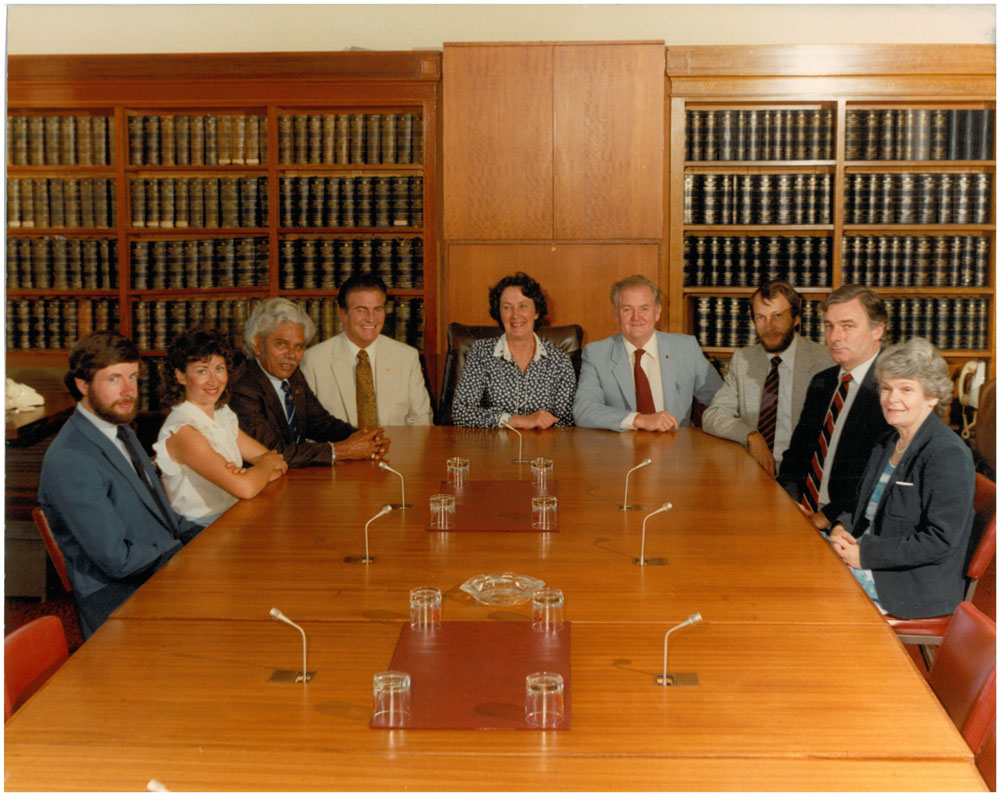 Standing Committee on Social Welfare, 1982. L-R: Peter Hallahan [Research Officer], Pam Gulloni [Research Officer], Senators Neville Bonner, Ron Elstob, Shirley Walters [Chair] and Bernie Kilgariff, Peter Keele [Secretary], Senators Don Grimes and Patricia Giles.
