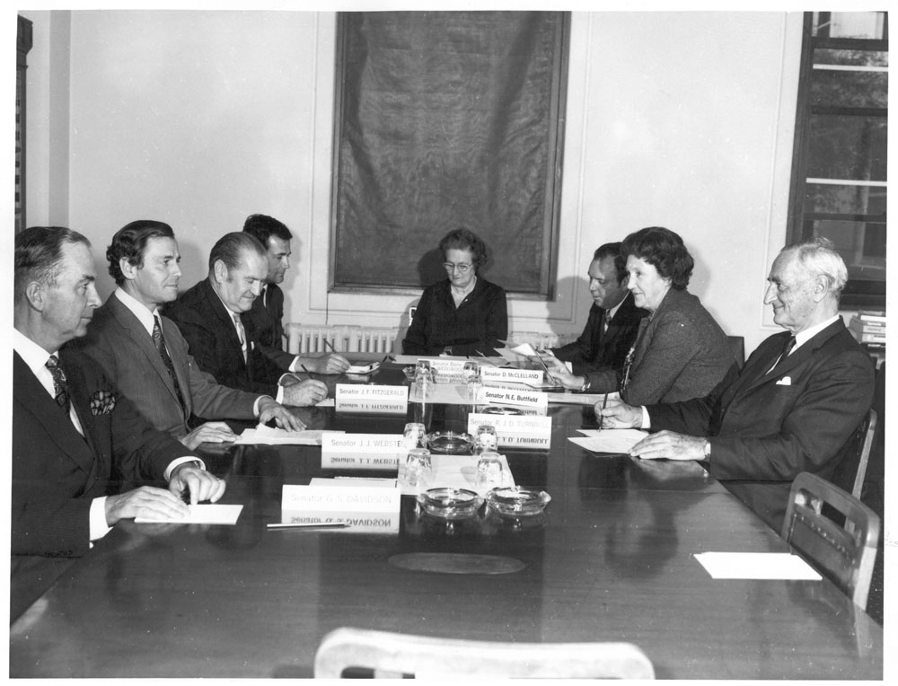 Standing Committee on Health and Welfare, 1971. L-R: Senators Gordon Davidson, James Webster and Joe Fitzgerald, Rex Hoy [Secretary], Senators Ivy Wedgwood [Chair], Douglas McClelland, Nancy Buttfield and Reg Turnbull.