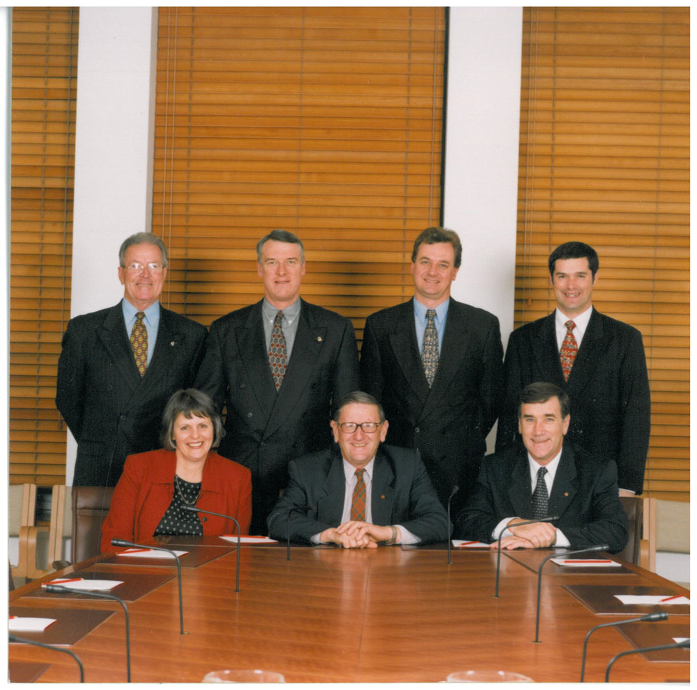 Select Committee on Superannuation and Financial Services, 2000. Standing L-R: Senators Ross Lightfoot, Grant Chapman, Nick Sherry [Deputy Chair] and Stephen Conroy. Seated L-R: Senators Lyn Allison, John Watson [Chair] and John Hogg.
