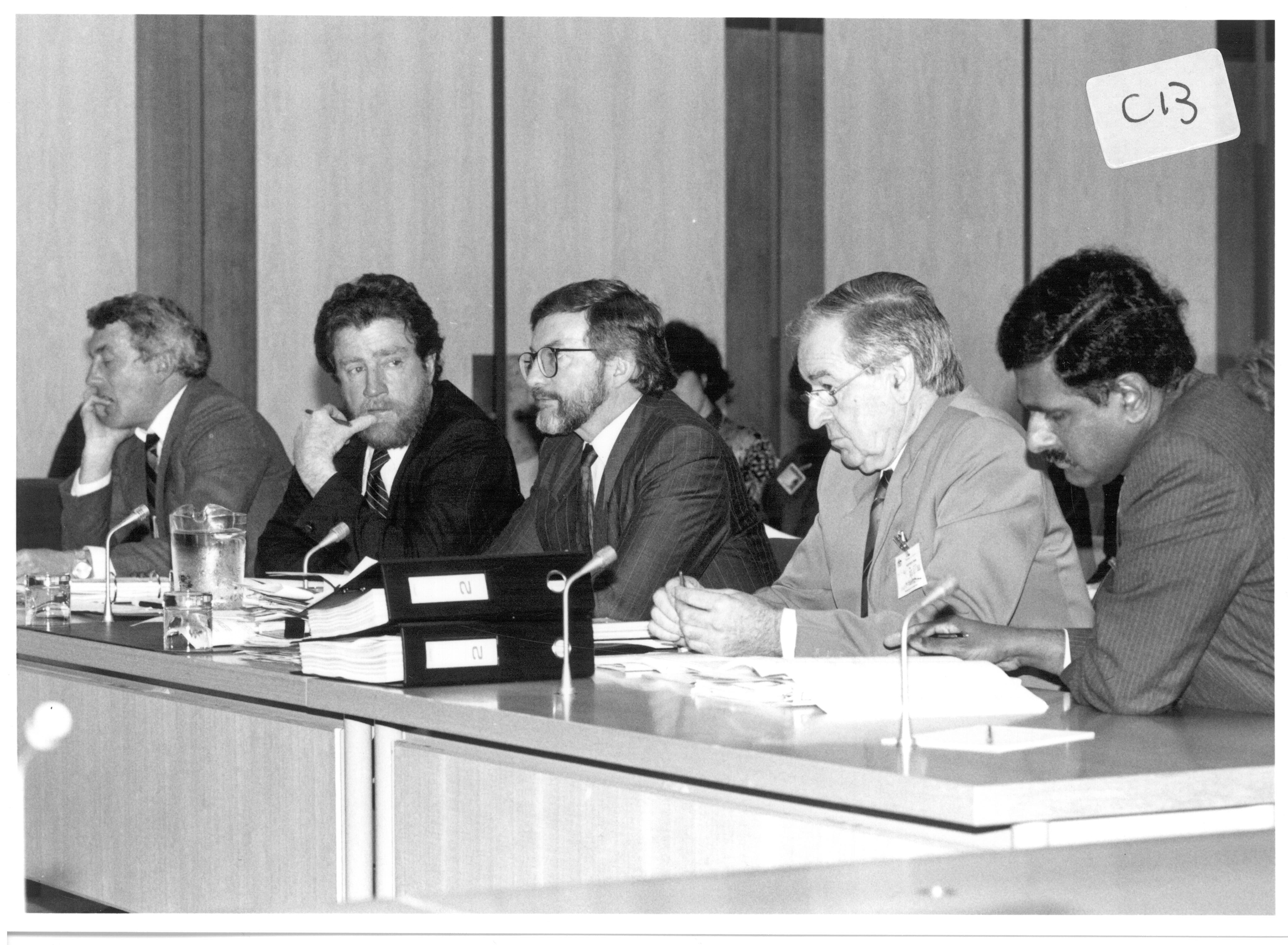 Estimates Committe F supplementary budget estimates hearing, 13 September 1990. L-R: Tom Munyard [Assistant Secretary, Corporate Services Branch, Department of Industrial Relations], Bob Marshman [Deputy Secretary, Department of Industrial Relations], Senator the Hon Peter Cook [Minister for Industrial Relations], Ken Stone [National Director, Australian Trade Union Training Authority] and Trevor Prabhakaran [Acting Manager, Administration and Finance, Australian Trade Union Training Authority]. Image by Peter West, Government Photographic Service.