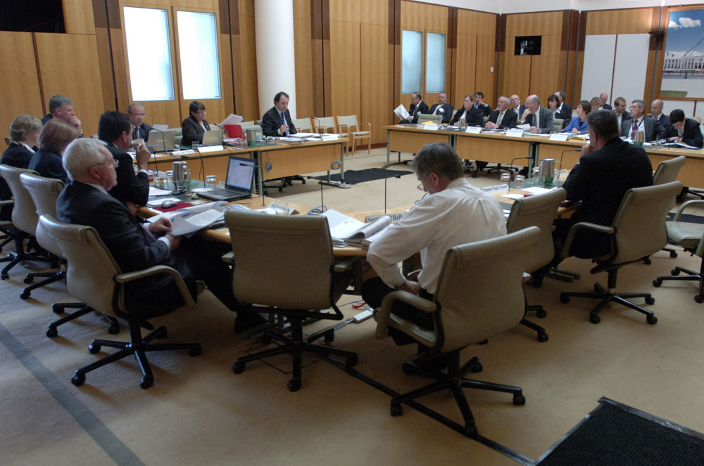 Committee members examining documents while Senator Julian McGauran questions officers from the Department of Agriculture, Fisheries and Forestry during the supplementary budget estimates hearing, 20 October 2008. DPS Auspic.