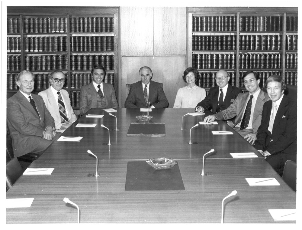 Standing Committee on Foreign Affairs and Defence, June 1978. L-R: Senators Douglas Scott and Cyril Primmer, Tony Magi [Secretary], Senator Peter Sim [Chair], Mary-Louise Willheim [Research Officer], Senators Gordon McIntosh, John Knight and Kerry Sibraa.