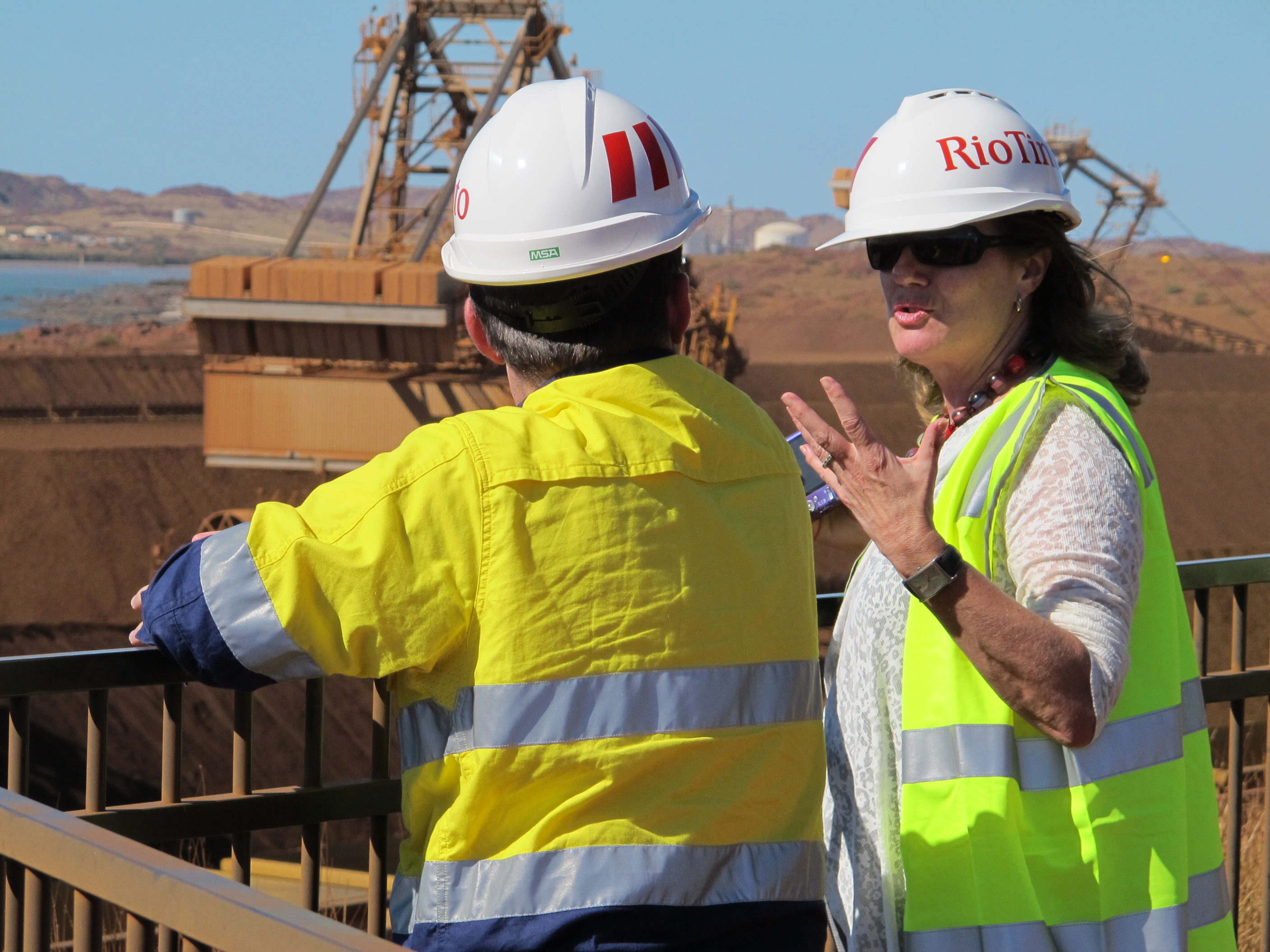Committee member Senator Helen Kroger speaking with a Rio Tinto employee about the operations of its iron ore export site at Dampier Port, 23 April 2013.