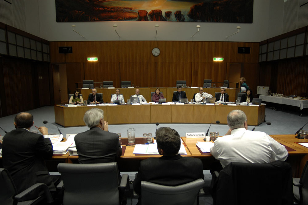 Standing Committee on Legal and Constitutional Affairs questioning Senator the Hon Chris Evans, Minister for Immigration and Citizenship, and officers from the Department of Immigration and Citizenship at a supplementary budget estimates hearing, 21 October 2008. Seated facing camera L-R: Senators Sarah Hanson-Young, Russell Trood, Don Farrell, Gavin Marshall and Trish Crossin [Chair], Peter Hallahan [Secretary], Senators Guy Barnett [Deputy Chair], Chris Ellison and Concetta Fierravanti-Wells. Senator Mary Jo Fisher walking towards top row of seats. DPS Auspic.