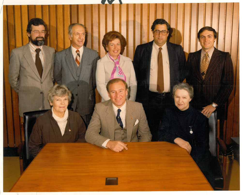 Standing Committee on Education and the Arts, February 1983. Standing L-R: Terry Brown [Secretary], Senators Misha Lajovic, Margaret Reid and Robert Ray, and Wayne Kathage [Research Officer]. Seated L-R: Senators Patricia Giles, Baden Teague [Chair] and Jean Hearn.