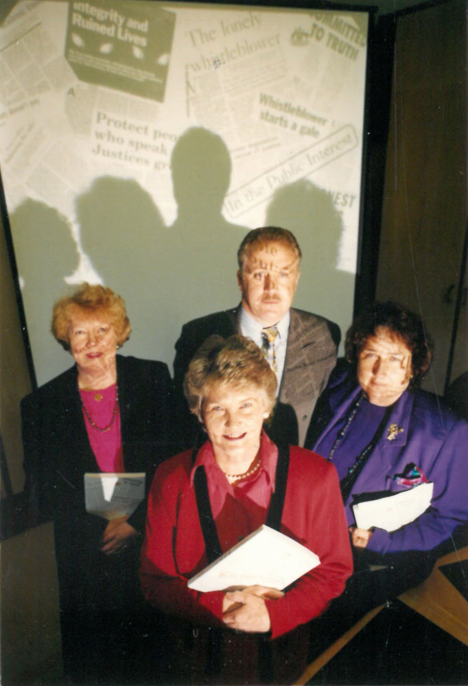 Committee members posing with the report, 31 August 1994. Clockwise from top: Senators Shayne Murphy [Deputy Chair], Christabel Chamarette, Jocelyn Newman [Chair] and Kay Denman. DPS Auspic.