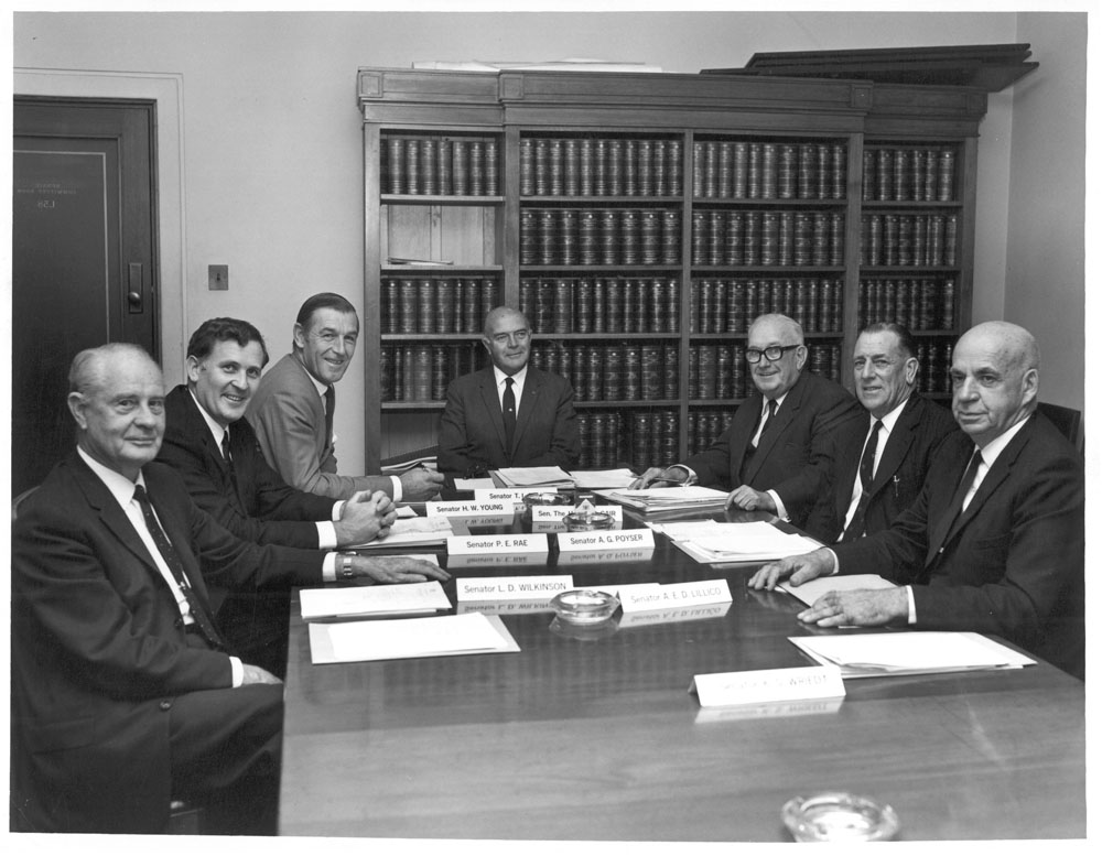Standing Committee on Primary and Secondary Industry and Trade, April 1971. L-R: Senators Laurie Wilkinson, Peter Rae, Harold Young, Tom Bull [Chair], Vincent Gair, George Poyser and Alexander Lillico. NAA: A1200, L95293.
