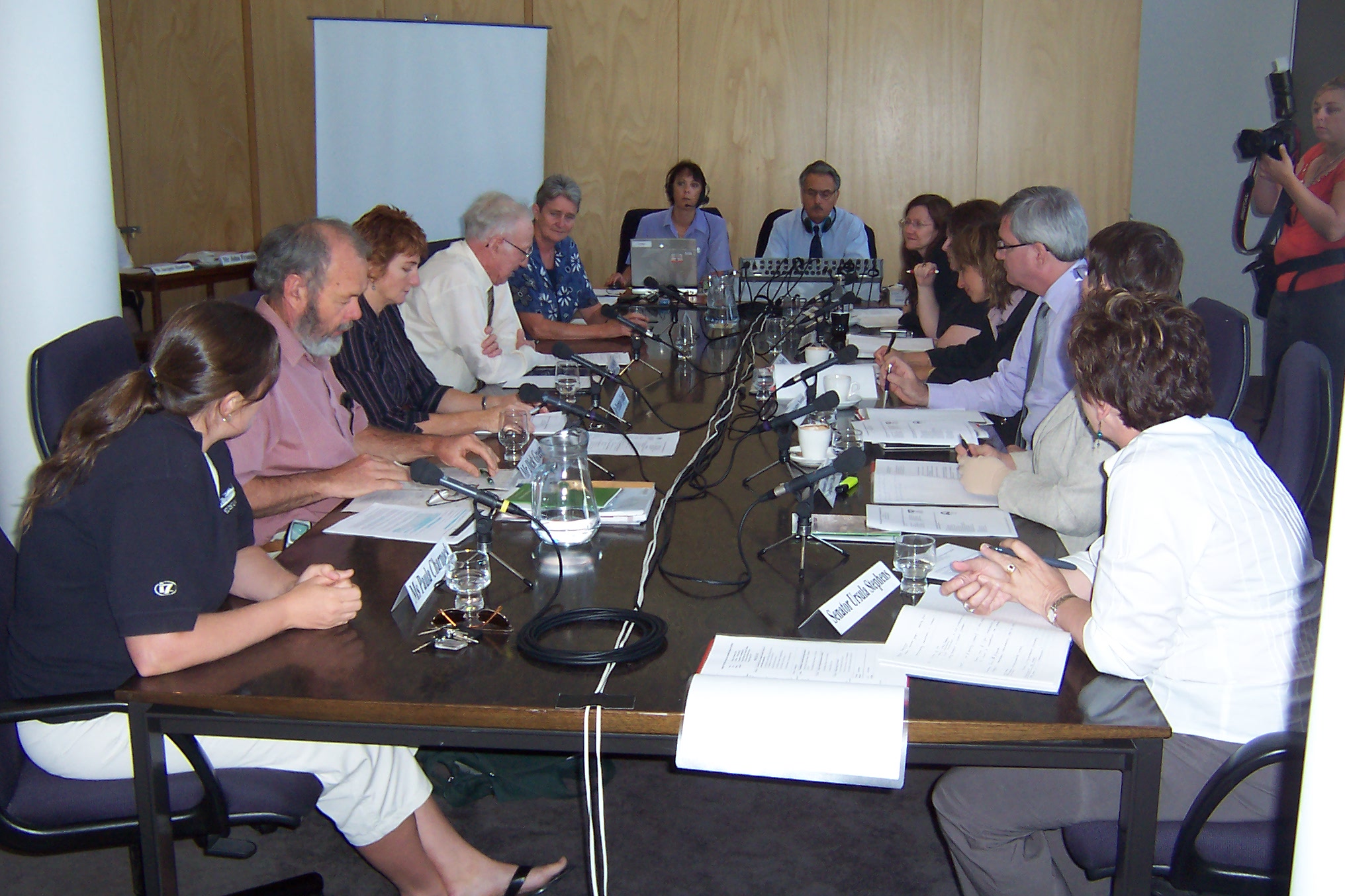 Committee hearing at Wagga Wagga, 10 February 2006. L-R: Paula Charnock [President, Wagga Wagga Urban Landcare], Dick Green [G0 Green Services], Dr Petrina Quinn [Central Riverina Landcare Network], James Phillips, Sister Carmel Wallis [Erin Earth], Hansard officer, Broadcasting officer, Senators Rachel Siewert and Ruth Webster, Jaquie Dewar [Committee Secretary], Senators Andrew Bartlett, Judith Adams and Ursula Stephens.