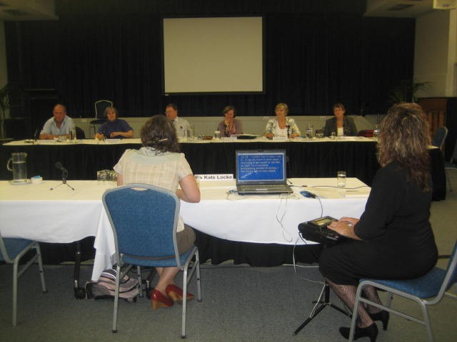 Community Affairs References Committee hearing, Wesley Conference Centre, Sydney, 11 November 2009. Witness Kate Locke appears before (L-R) Senators John Williams, Claire Moore, [unknown], Rachel Siewert, Sue Boyce and Judith Adams.