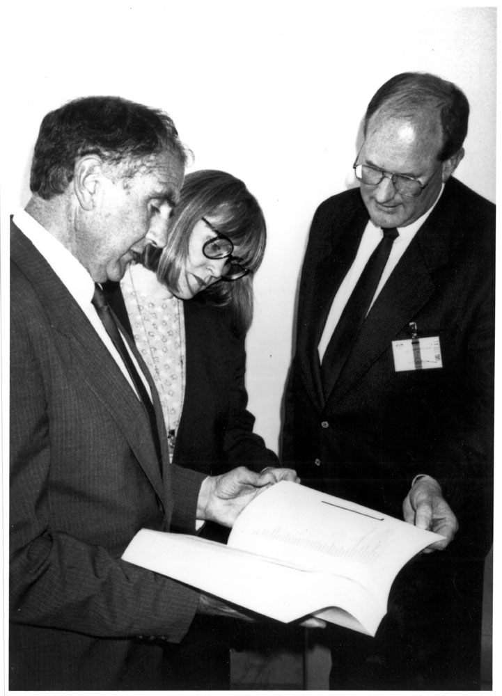 The chair and secretary of the Standing Committee on Legal and Constitutional Affairs, Senator Barney Cooney and Bronwyn McNaughton, accepting the Law Council of Australia's submission to the inquiry into the cost of justice from Peter Levy, Secretary-General of the Law Council (right), 1990. Image courtesy of the Law Council of Australia.