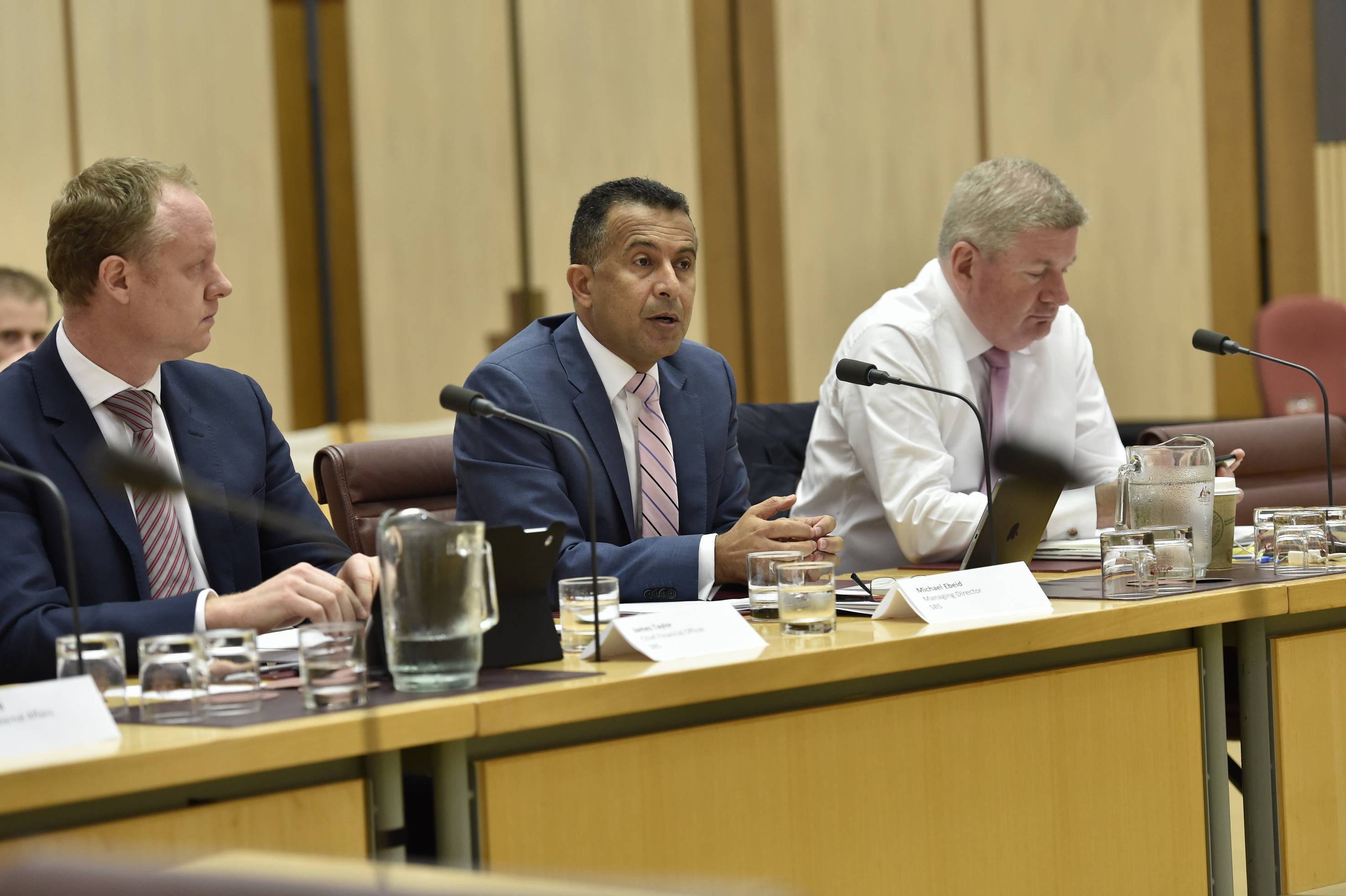 Officers from the Special Broadcasting Service (SBS) and Senator the Hon Mitch Fifield (right) appearing before the Environment and Communications Legislation Committee, 9 February 2016. DPS Auspic.