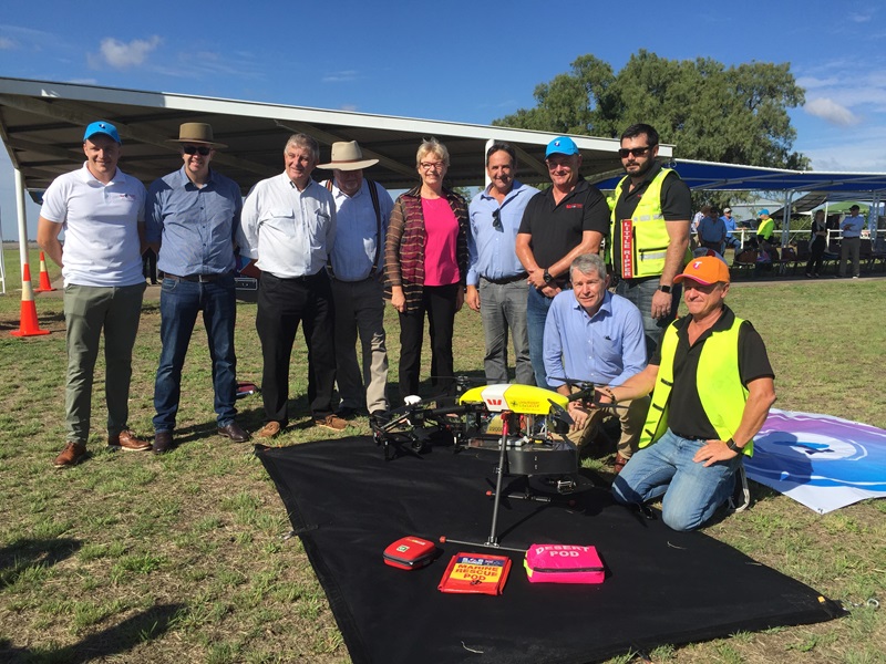 Committee members view the Westpac ‘Little Ripper Lifesaver’ in Dalby, Queensland, 16 March 2017. L-R: Stephen Harley [General Manager, Chief Technology Office, Telstra Corporation], Senators Anthony Chisholm, Chris Back, Barry O'Sullivan [Deputy Chair], Janet Rice and Glenn Sterle [Chair], Eddie Bennet [CEO, The Ripper Group] and Ben Trollope [Chief Operations Officer, The Ripper Group]. Kneeling, L-R: Senator David Fawcett and Operator, Westpac Little Ripper Lifesaver.