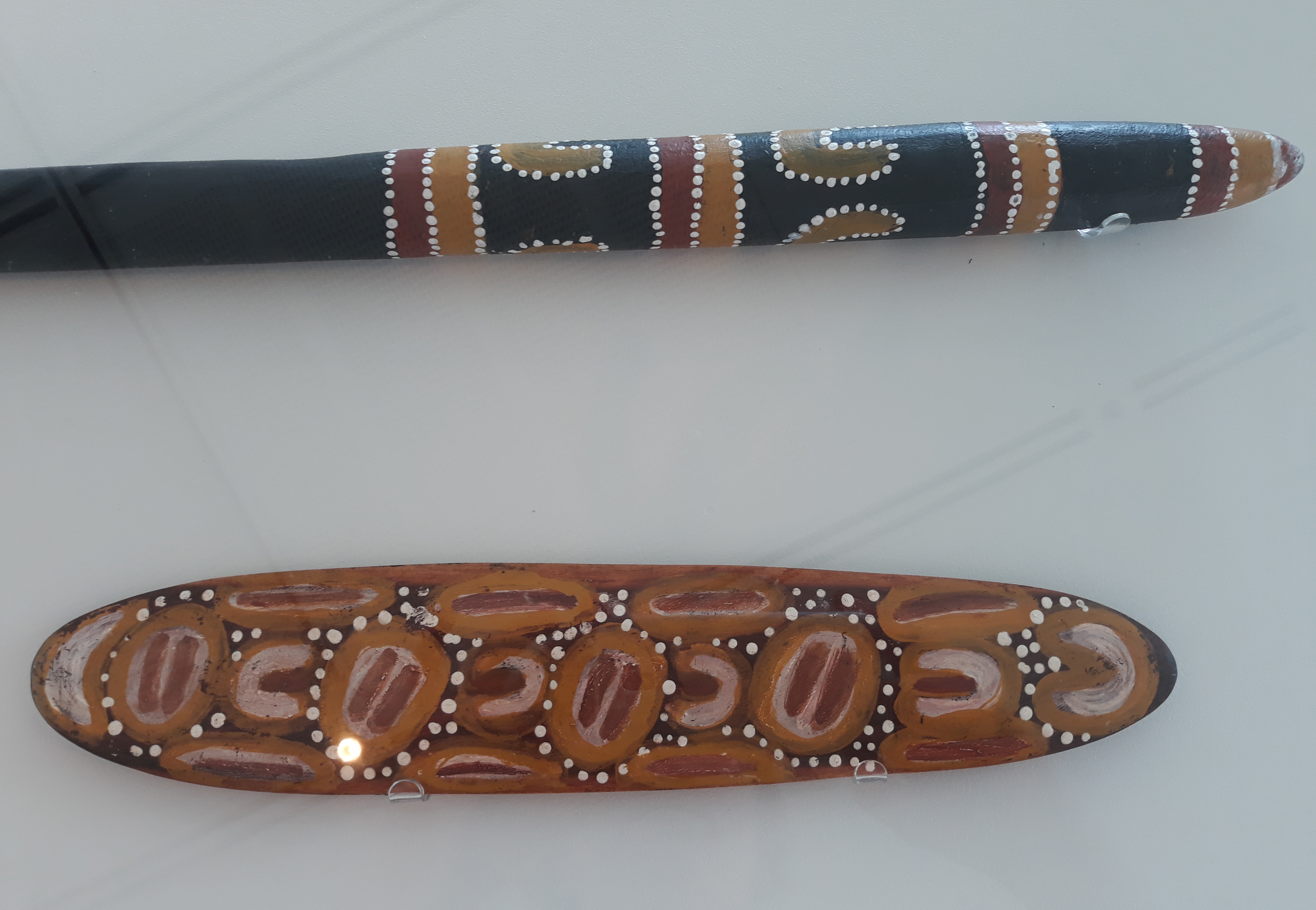 Ceremonial artefacts submitted by members of the Uluru-Kata Tjuta National Park Board of Management  to the committee during a hearing in Adelaide on 12 March 1999.  The artefacts bear a message to the Senate that the Anangu people of Uluru wish to continue a relationship with the Parliament. The traditional owners objected to changes to Uluru-Kata Tjuta National Park management arrangements in the proposed legislation.